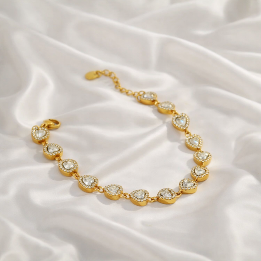 Bracelet femme en acier inoxydable doré avec maillons goutte sertis de zircons, modèle Léonia